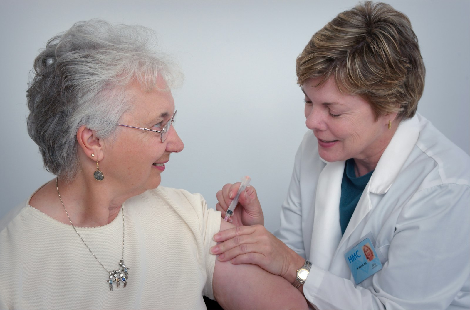 A nurse caring for a senior patient with warmth